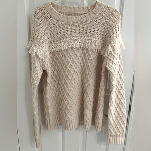 Fringed cable knit sweater